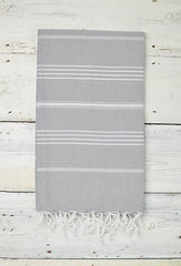 light grey hammam towel with fringe and hand tied tassels